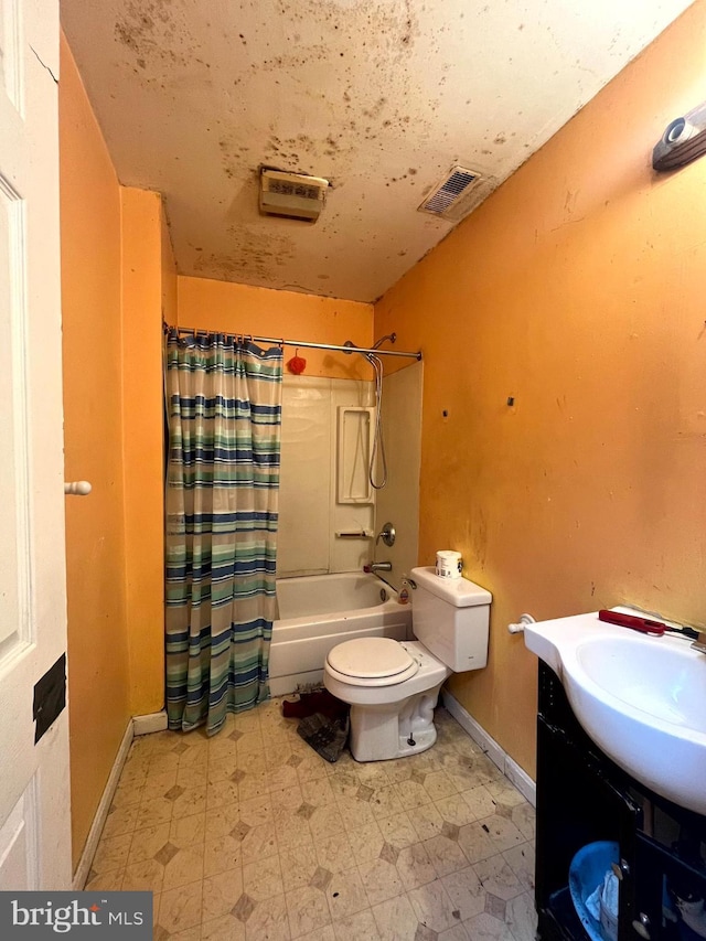 full bathroom featuring toilet, vanity, visible vents, tile patterned floors, and shower / bath combo with shower curtain