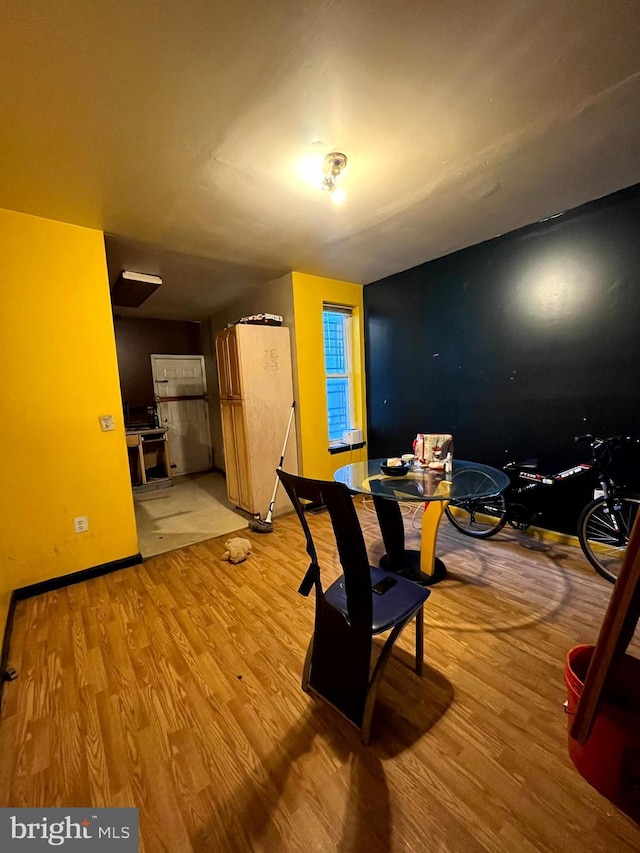 dining space featuring light wood-type flooring