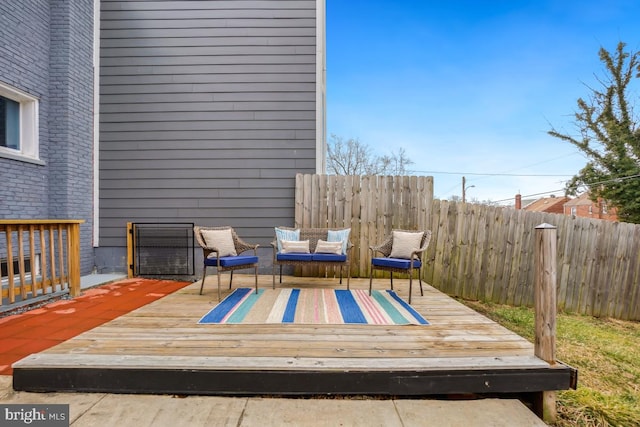 wooden deck featuring fence