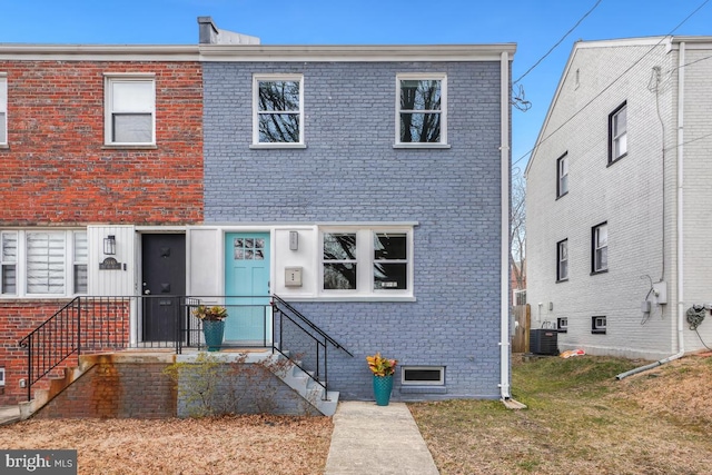 multi unit property featuring central AC and brick siding