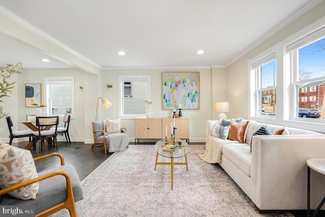 living room with ornamental molding, recessed lighting, baseboards, and wood finished floors