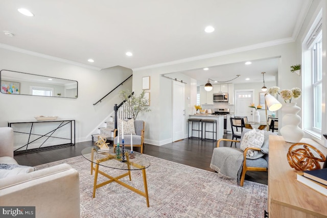 living room featuring dark wood-style floors, recessed lighting, ornamental molding, and stairway