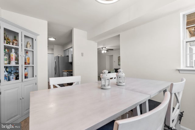 dining space with a ceiling fan