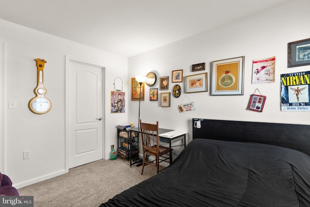 carpeted bedroom featuring baseboards