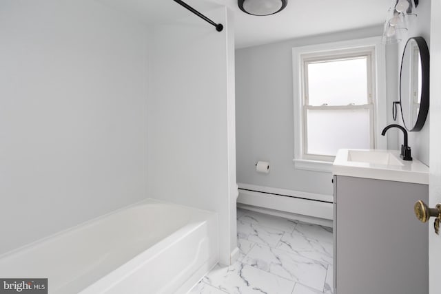 bathroom featuring baseboard heating, marble finish floor, and vanity