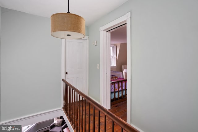 corridor featuring wood finished floors