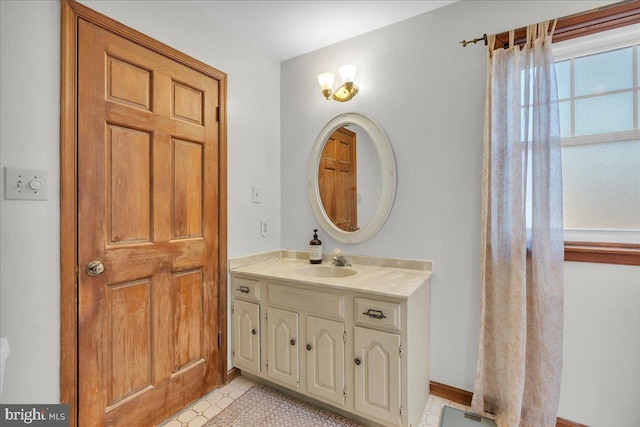 bathroom with vanity and tile patterned floors