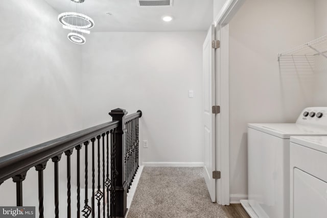 washroom featuring laundry area, baseboards, light colored carpet, washing machine and dryer, and recessed lighting