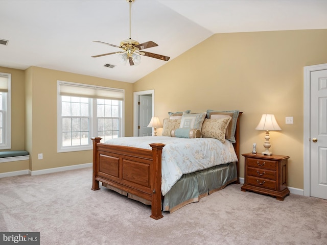 bedroom featuring vaulted ceiling, carpet flooring, and visible vents