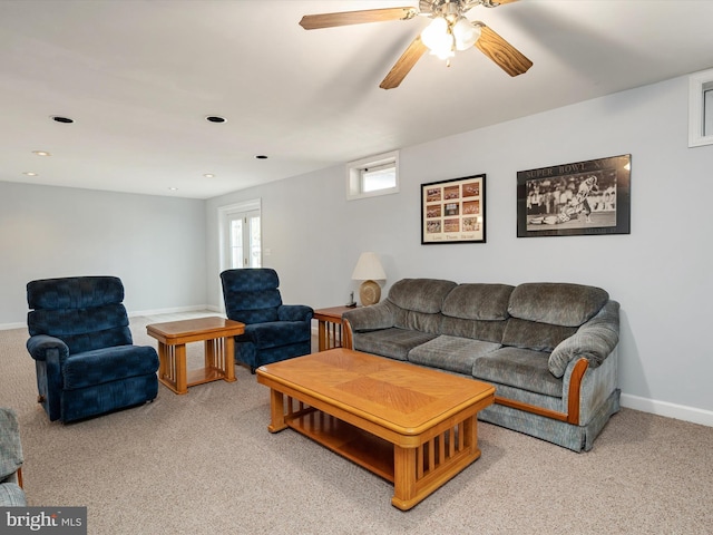 living room featuring recessed lighting, baseboards, a ceiling fan, and light colored carpet