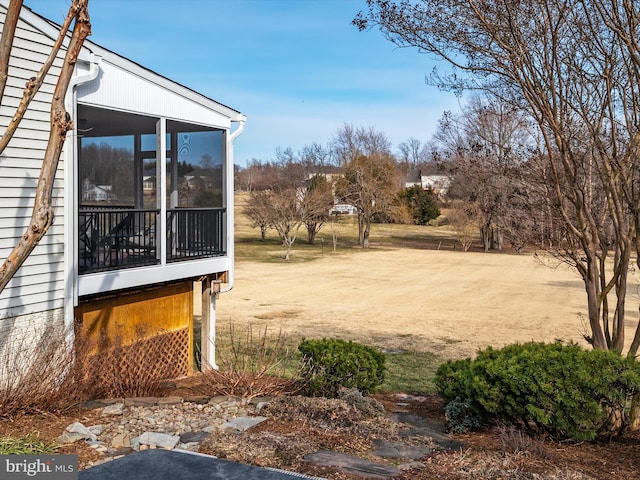 view of yard with a sunroom