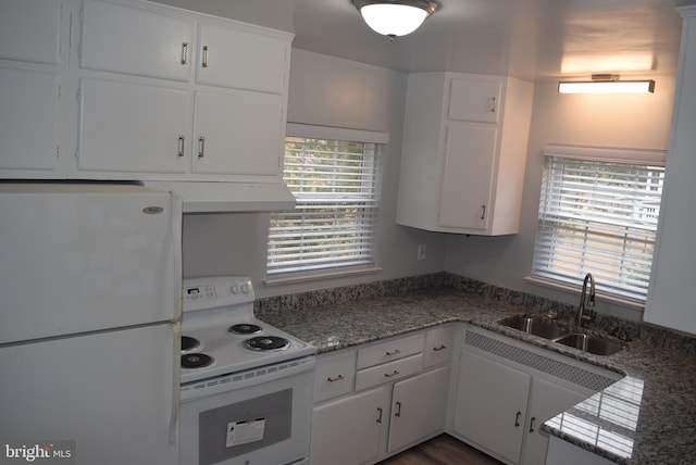 kitchen featuring white appliances, a sink, and white cabinets