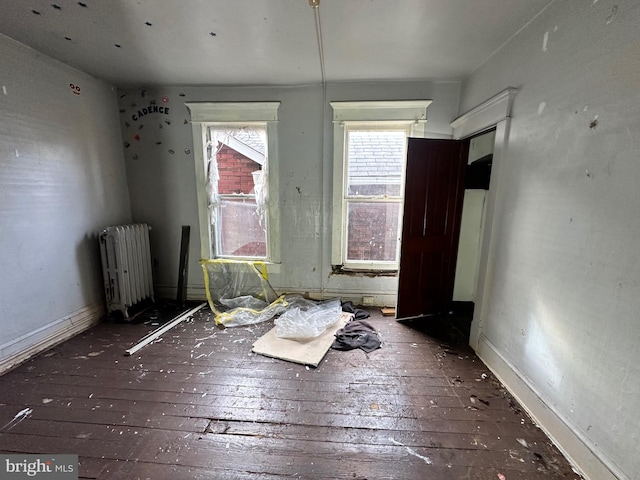 interior space featuring hardwood / wood-style floors and radiator heating unit