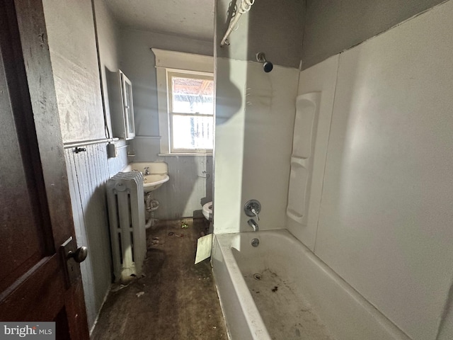 bathroom featuring shower / washtub combination, radiator, and toilet