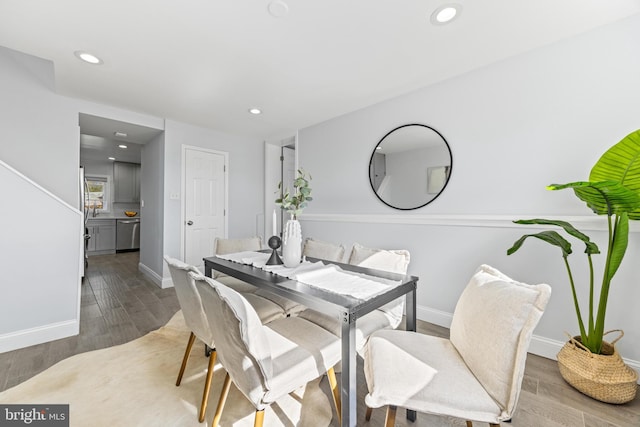 dining area featuring recessed lighting, baseboards, and wood finished floors