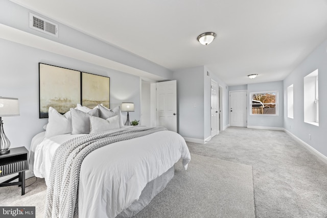 bedroom featuring carpet, visible vents, and baseboards