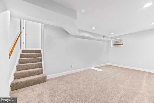 basement featuring recessed lighting, carpet flooring, baseboards, and stairs