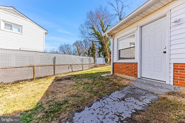 view of yard featuring entry steps and fence