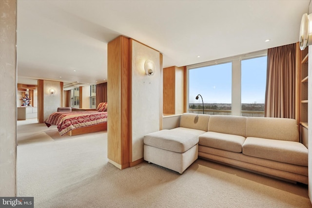 carpeted bedroom with recessed lighting