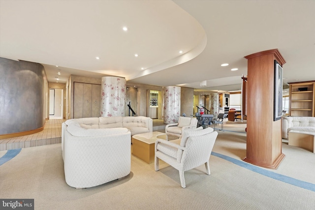 living room with light carpet, ornate columns, and recessed lighting