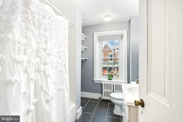 bathroom with baseboards, toilet, radiator heating unit, tile patterned floors, and vanity