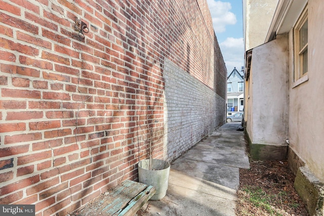 view of property exterior with brick siding