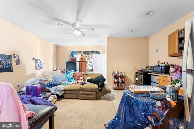 interior space with light carpet and a ceiling fan