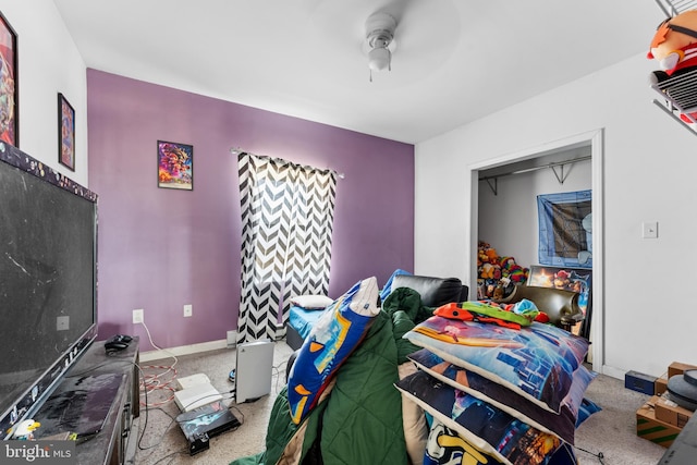 bedroom with baseboards, a ceiling fan, and carpet flooring