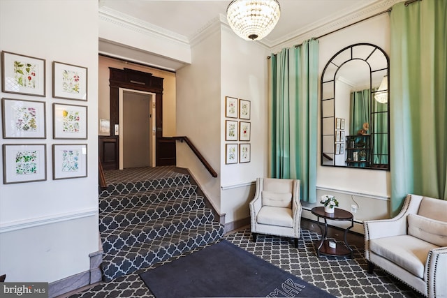 interior space featuring carpet floors, an inviting chandelier, baseboards, and crown molding