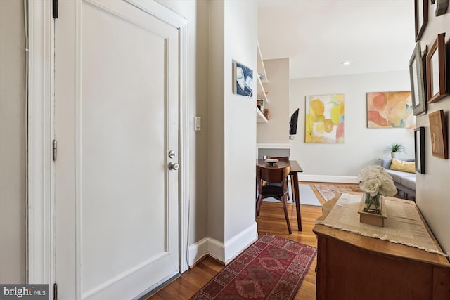 entrance foyer with baseboards, dark wood-type flooring, and recessed lighting