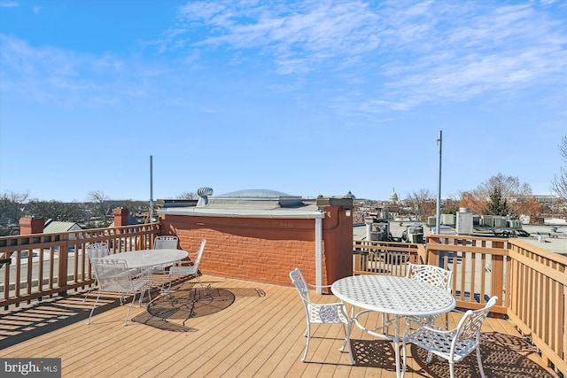 wooden deck with outdoor dining area