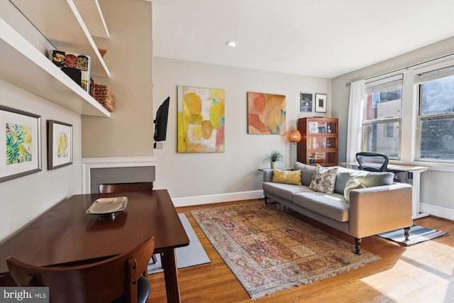 sitting room with recessed lighting, wood finished floors, and baseboards