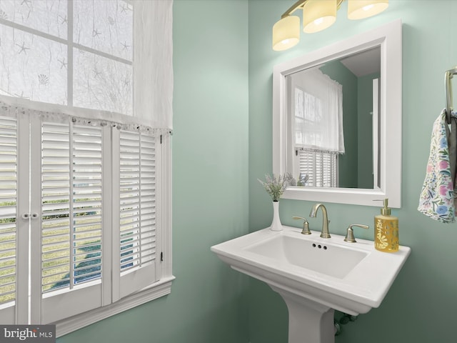 bathroom with a wealth of natural light and a sink