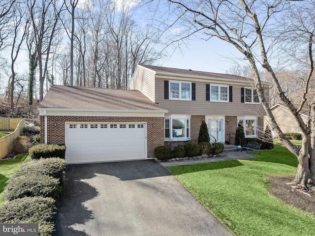 view of front of home with a front lawn, aphalt driveway, an attached garage, fence, and brick siding