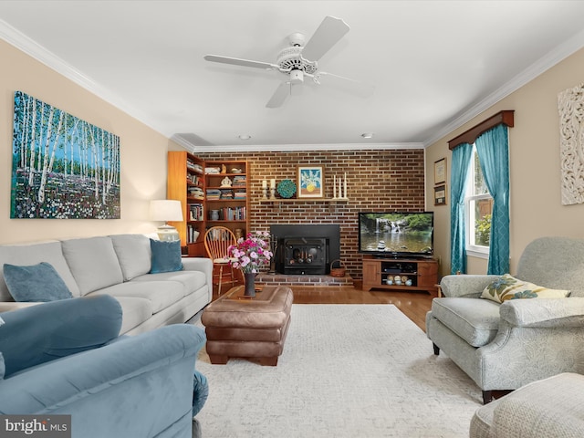 living room with ceiling fan, wood finished floors, and ornamental molding