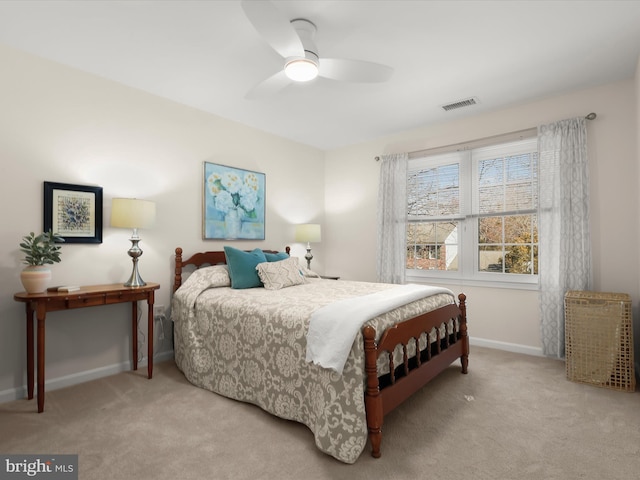 bedroom with baseboards, a ceiling fan, carpet flooring, and visible vents