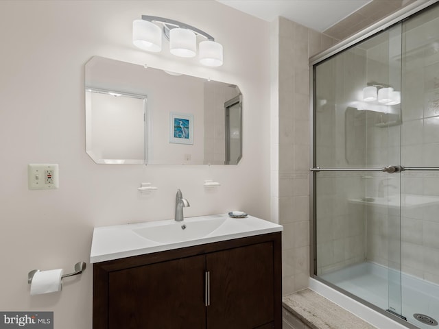 full bathroom featuring vanity and a stall shower