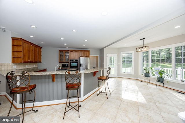 2729 Hollow View Dr, Finksburg, MD 21048 - kitchen with stainless steel fridge, black oven, open shelves, a peninsula, and decorative backsplash