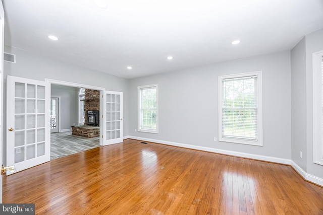 2729 Hollow View Dr, Finksburg, MD 21048 - unfurnished living room featuring wood finished floors, baseboards, french doors, a fireplace, and recessed lighting