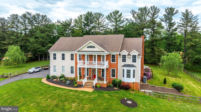 2729 Hollow View Dr, Finksburg, MD 21048 - view of front facade featuring a balcony, a chimney, and a porch