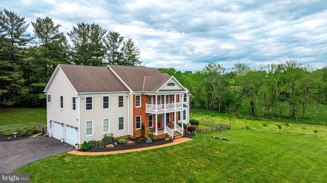 2729 Hollow View Dr, Finksburg, MD 21048 - view of front of house with a balcony, asphalt driveway, a garage, a front lawn, and a shingled roof