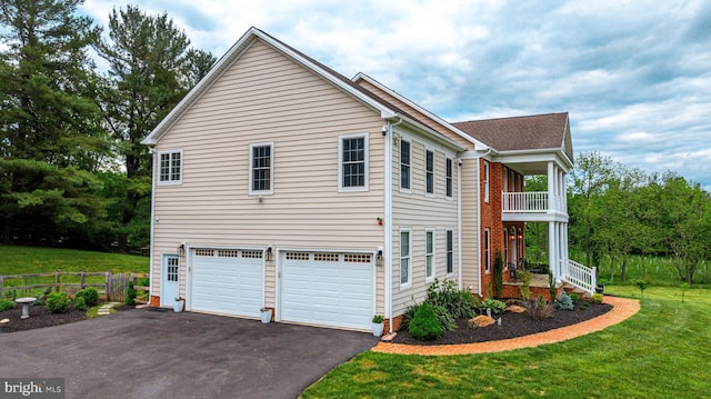 2729 Hollow View Dr, Finksburg, MD 21048 - view of property exterior with asphalt driveway, a balcony, and an attached garage