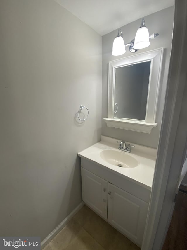 bathroom with vanity and baseboards