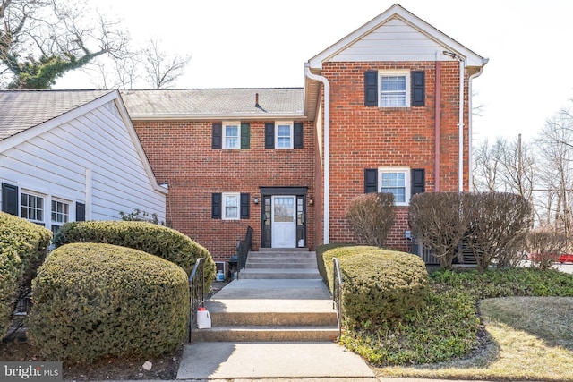 view of front of home with brick siding