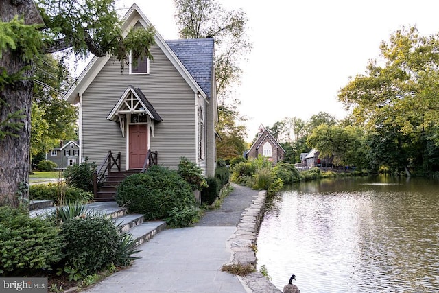 view of front of home featuring a water view