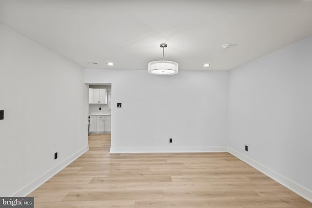 interior space with recessed lighting, light wood-type flooring, and baseboards