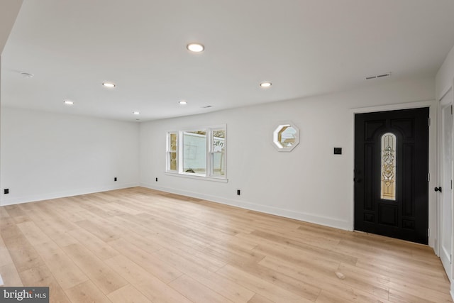 foyer entrance with recessed lighting, visible vents, light wood finished floors, and baseboards