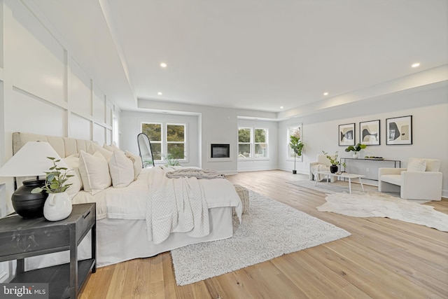 bedroom featuring wood finished floors and recessed lighting