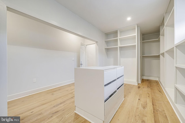 spacious closet featuring light wood-style floors