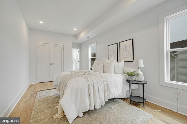 bedroom featuring recessed lighting, wood finished floors, and baseboards